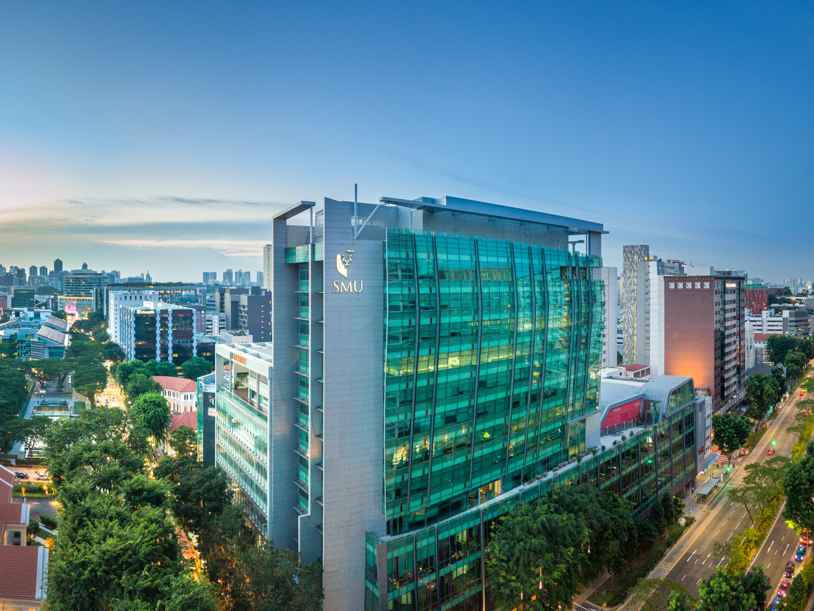 The SMU Administration Building on the Singapore Management University city campus at dusk